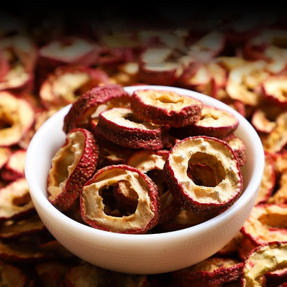 Brewed cup of golden honey colored hawthorn berry herbal tea