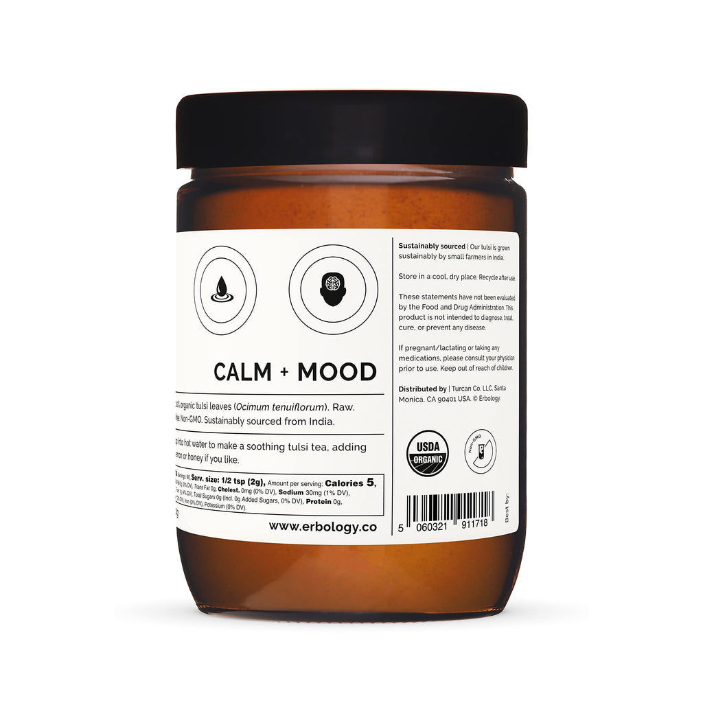 Erbology holy basil powder jar on a wooden background