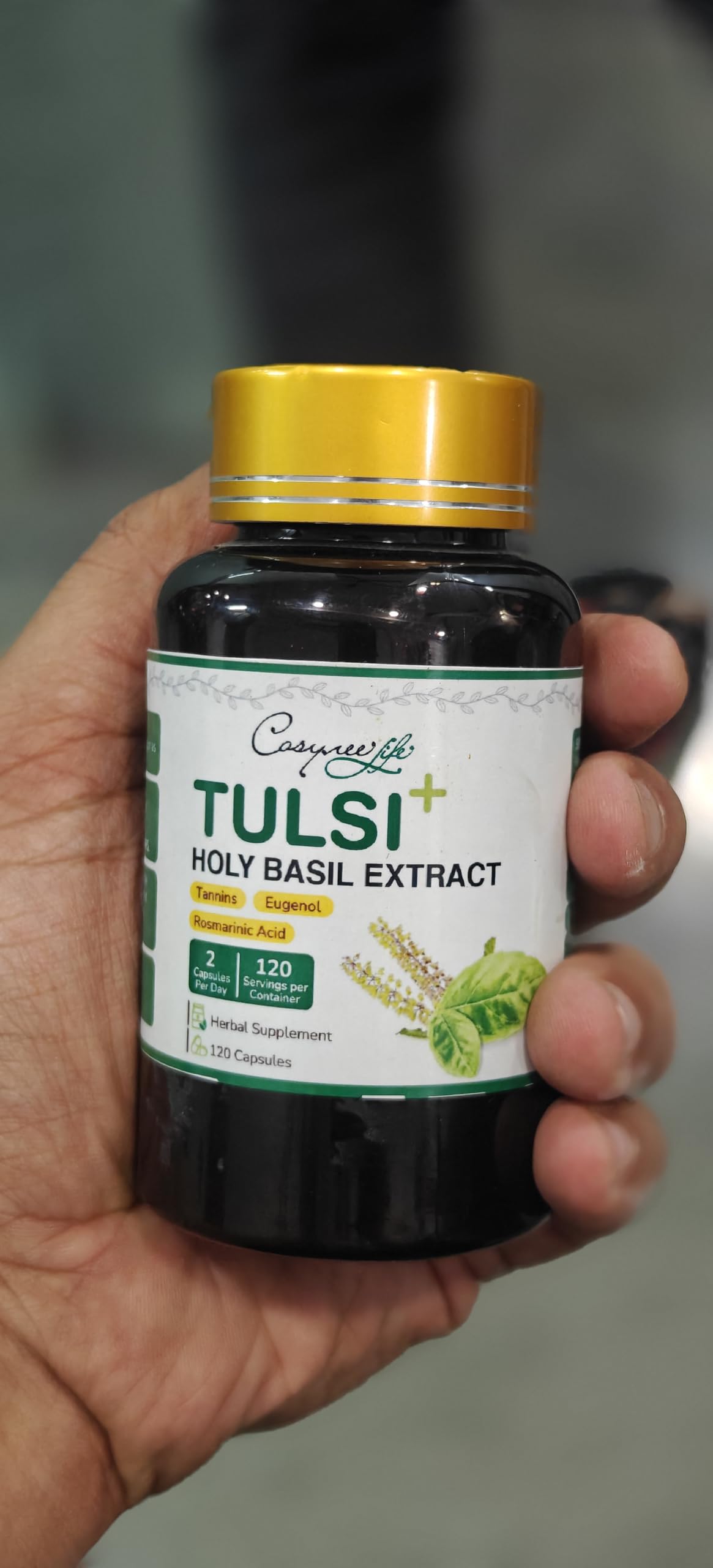Group of Cosynee Life Tulsi capsules outside the bottle