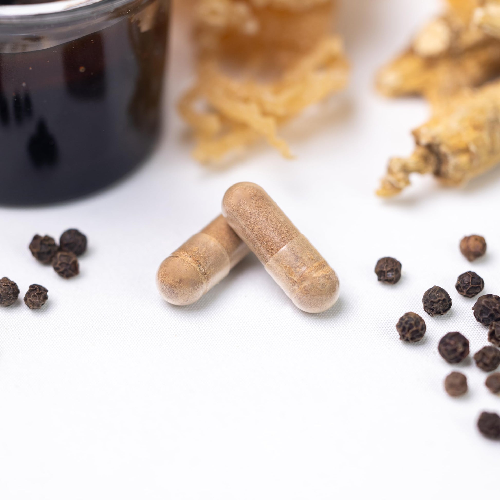 Close up image of Prime Natural Shilajit complex displaying manufacturing details and GMP compliance text.