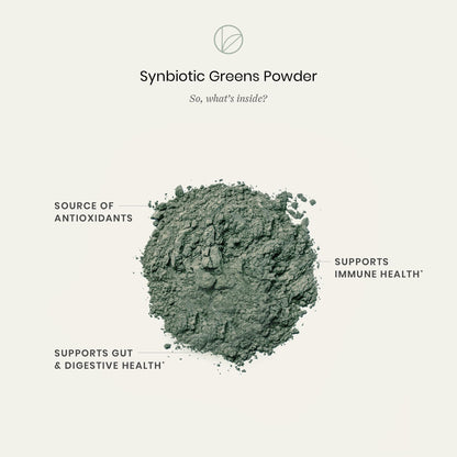 Pregnancy safe daily greens formula next to a fresh fruit smoothie in a bright setting