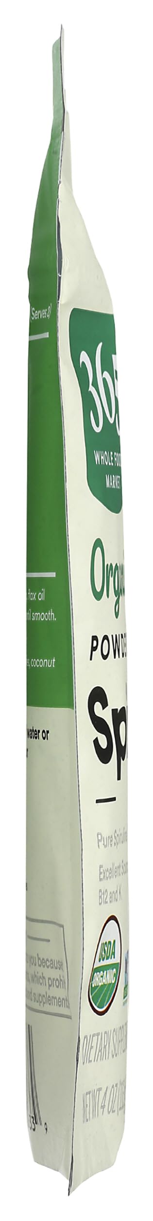 Imported USA organic spirulina powder being scooped for a healthy green smoothie blend