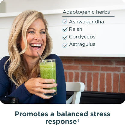 Ancient Nutrition wellness supplement scoop next to water glass