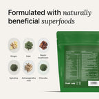 All in one greens drink mix prepared in a clear glass showing smooth texture