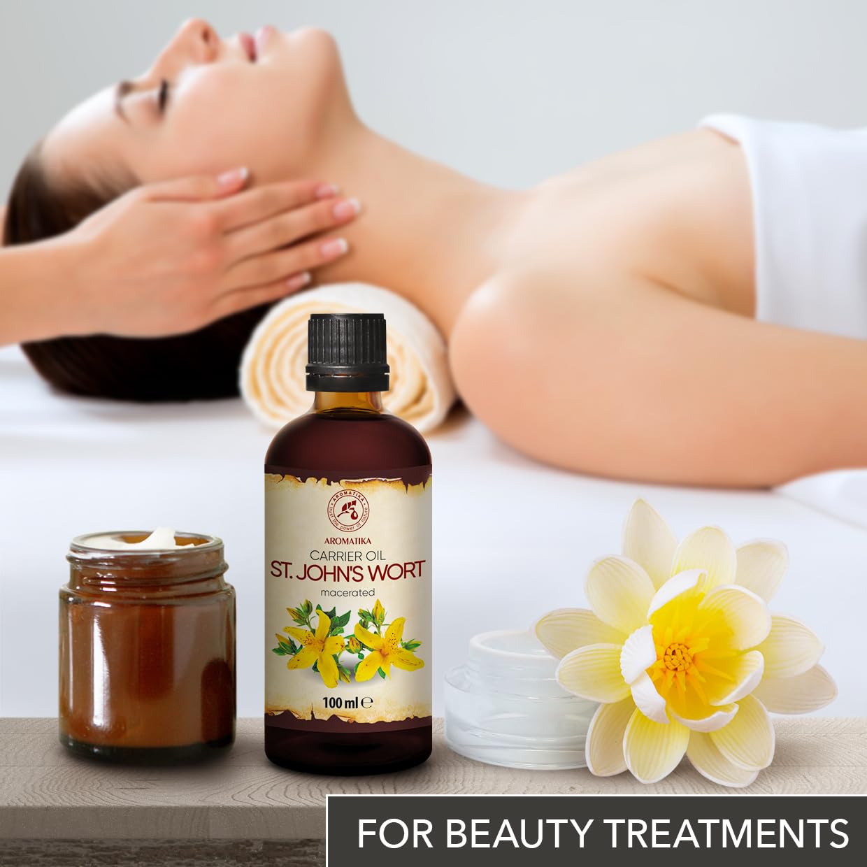 Aromatika 100ml botanical oil being poured for aromatherapy and body massage use.