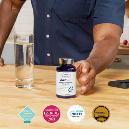Doctor-formulated supplement bottle resting on an organized lifestyle wellness setup.