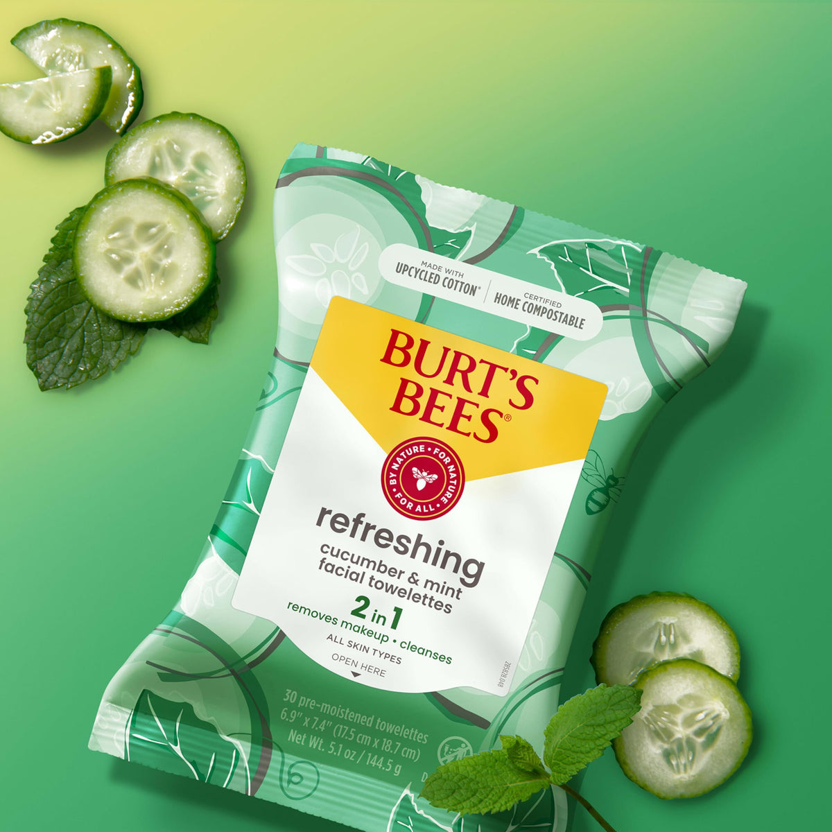 Model gently wiping face with Burt's Bees refreshing facial towelette