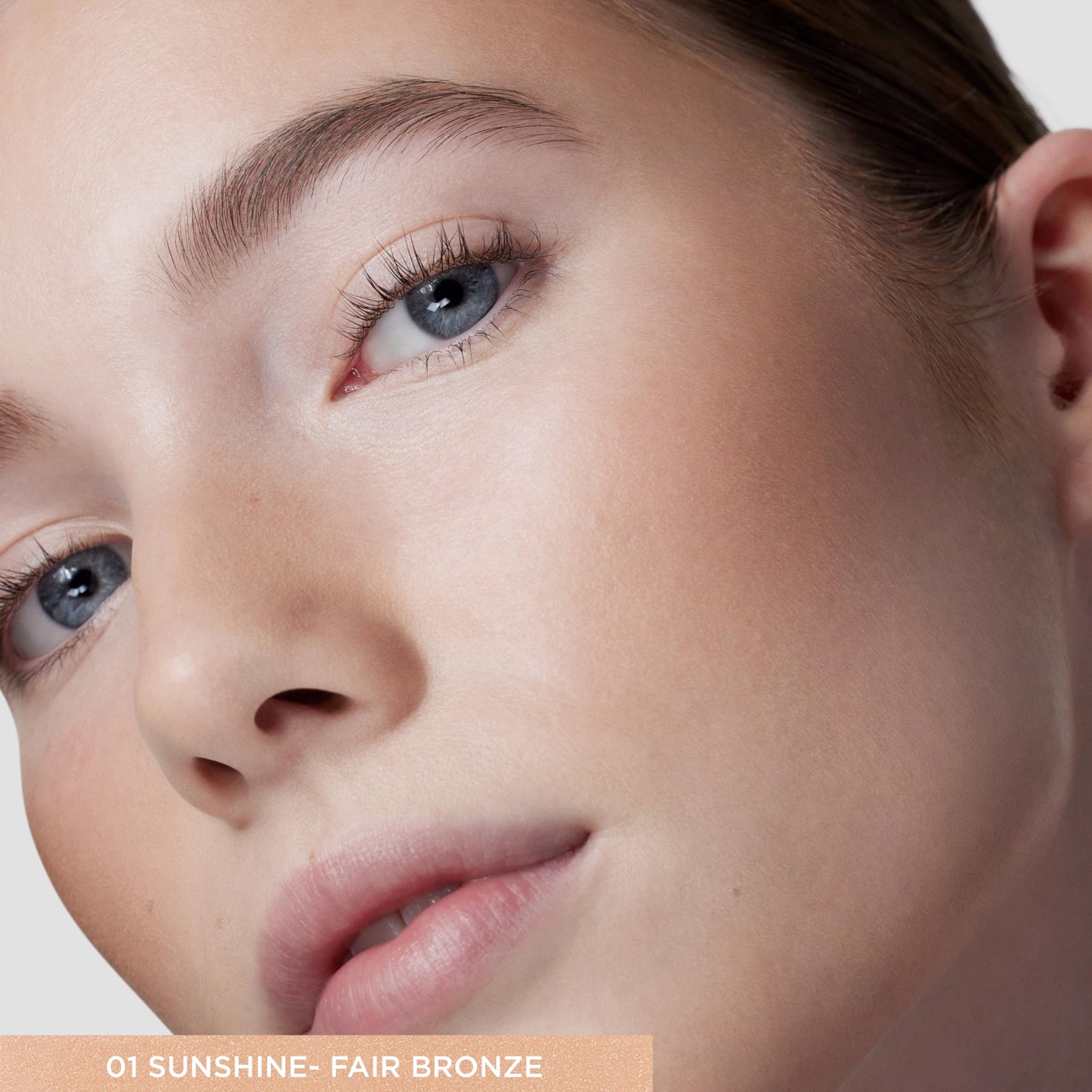 Hydrating sheer cream bronzer texture swatch on neutral background