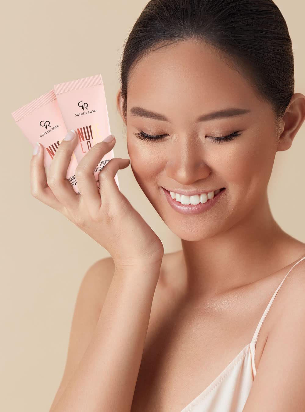 Authentic USA imported dewy cosmetic skin tint tube angled perspective
