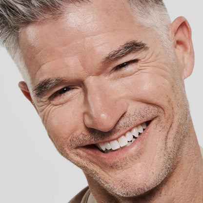 Dermatologist approved male skincare packaging highlighting Niacinamide and Squalane ingredients.