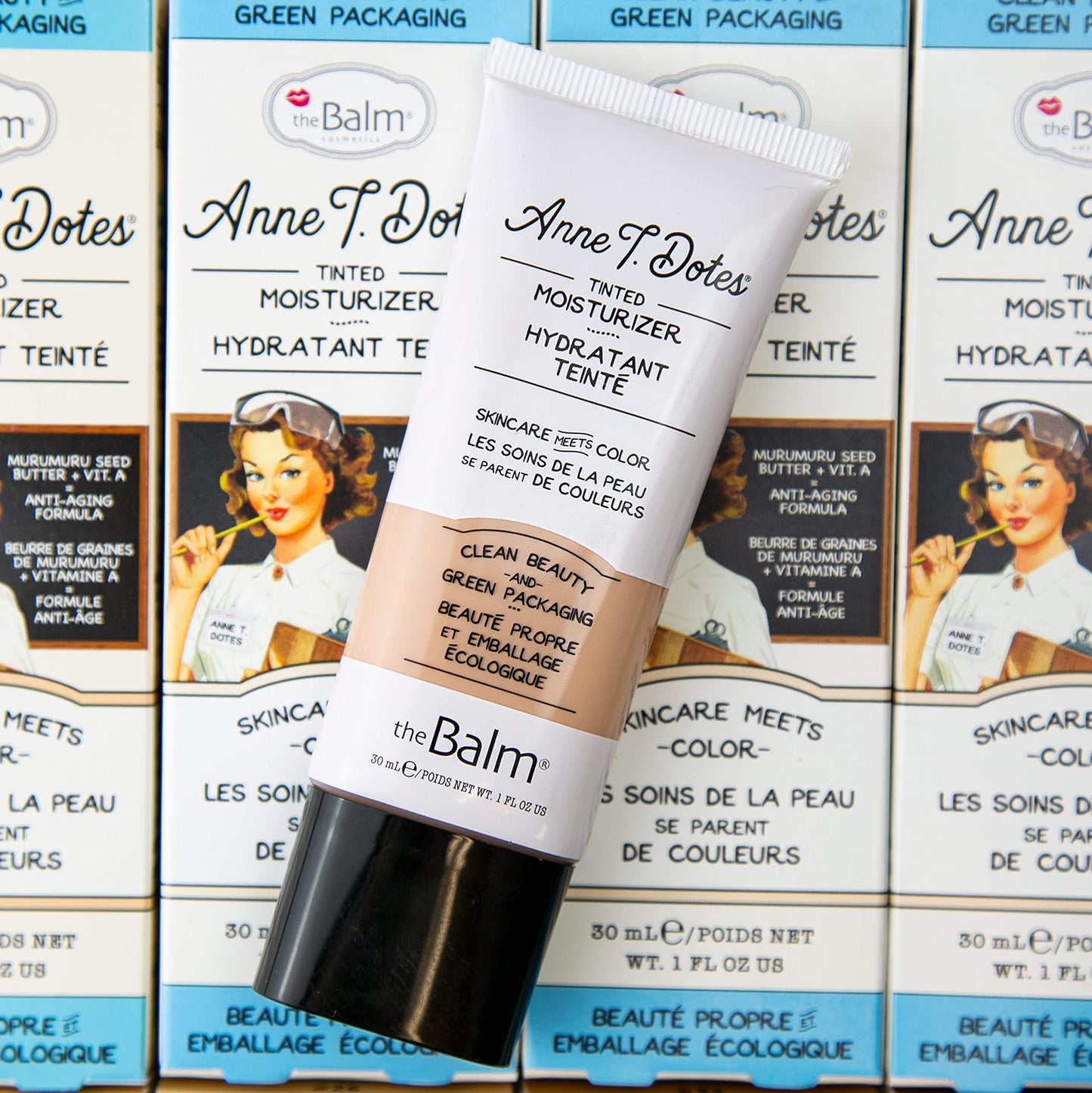TheBalm cosmetic tube cap open showing dispensing nozzle