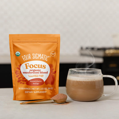 Four Sigmatic Focus Blend superfood powder scoop texture close up view.