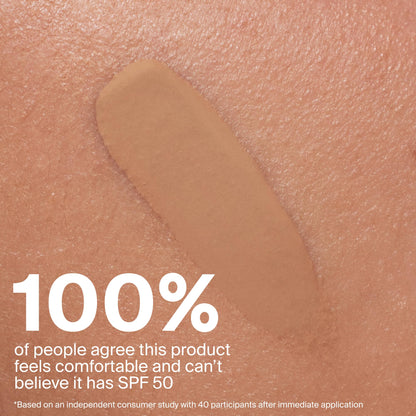 Non comedogenic daily skin tint SPF 50 bottle on clean background