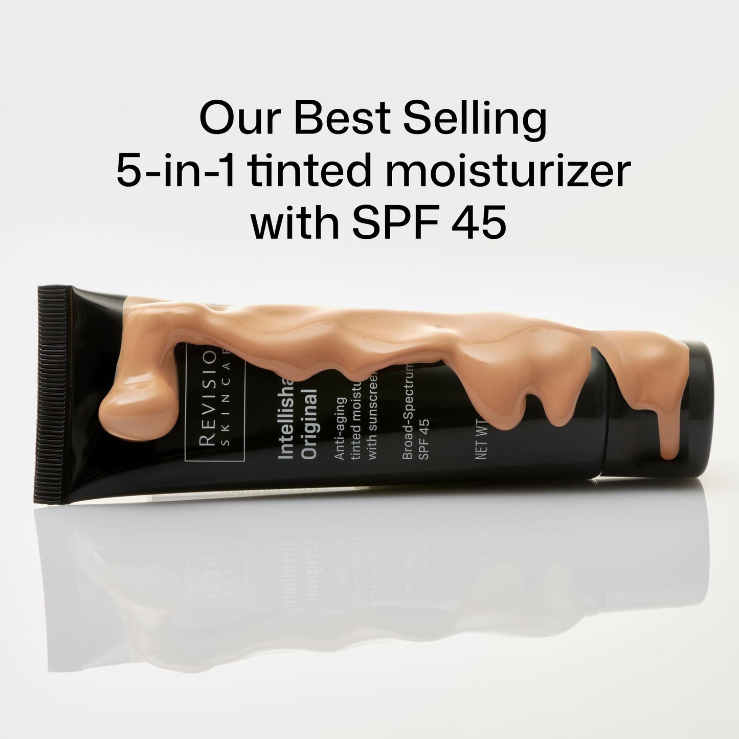 Revision anti aging tinted sunscreen tube on white background