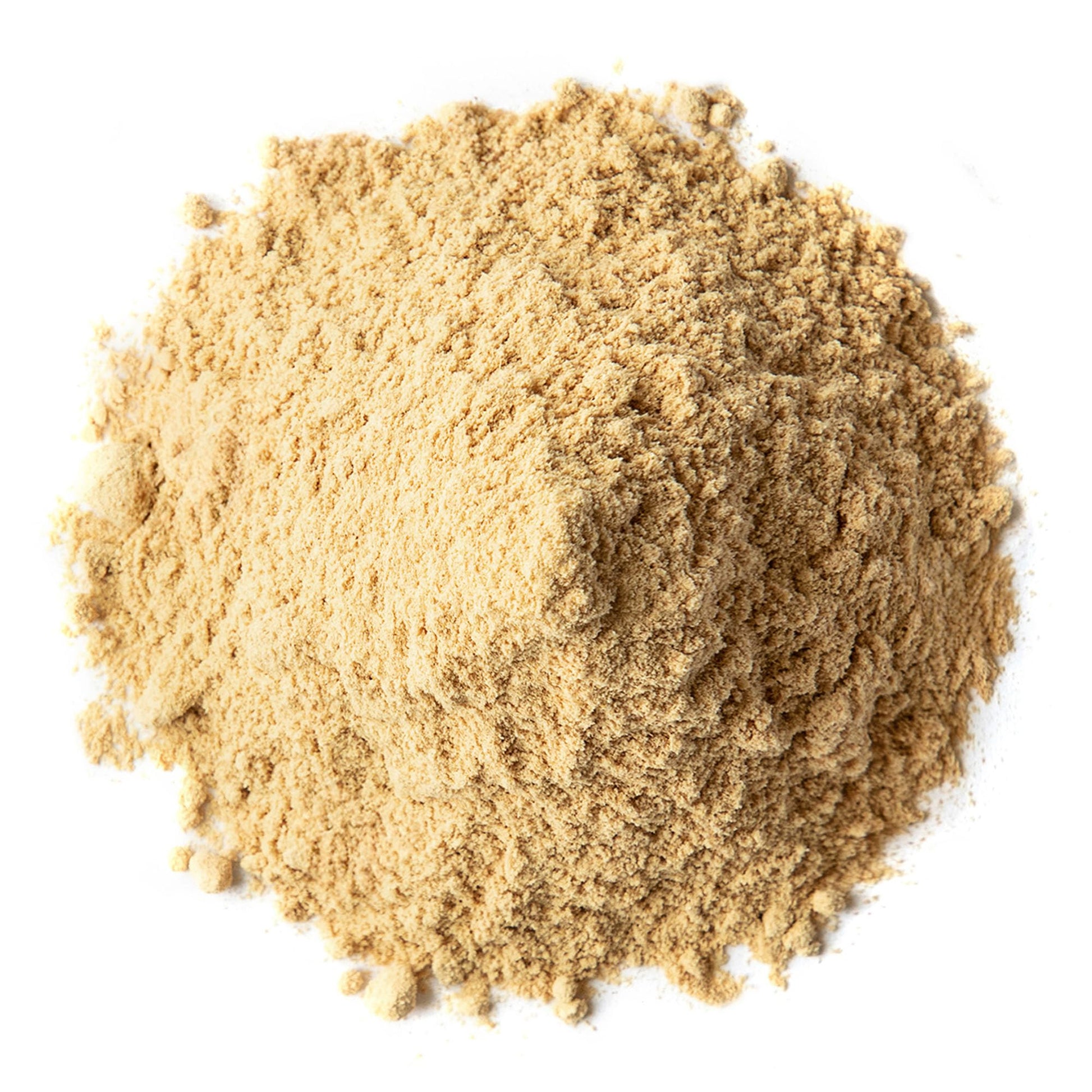 Organic Triphala powder poured into a warm herbal tea cup