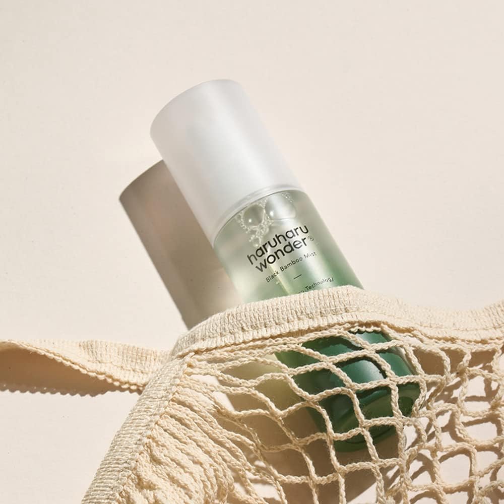 Haruharu Wonder Black Bamboo Mist angled product shot showing the precise fine spray mist nozzle tip.