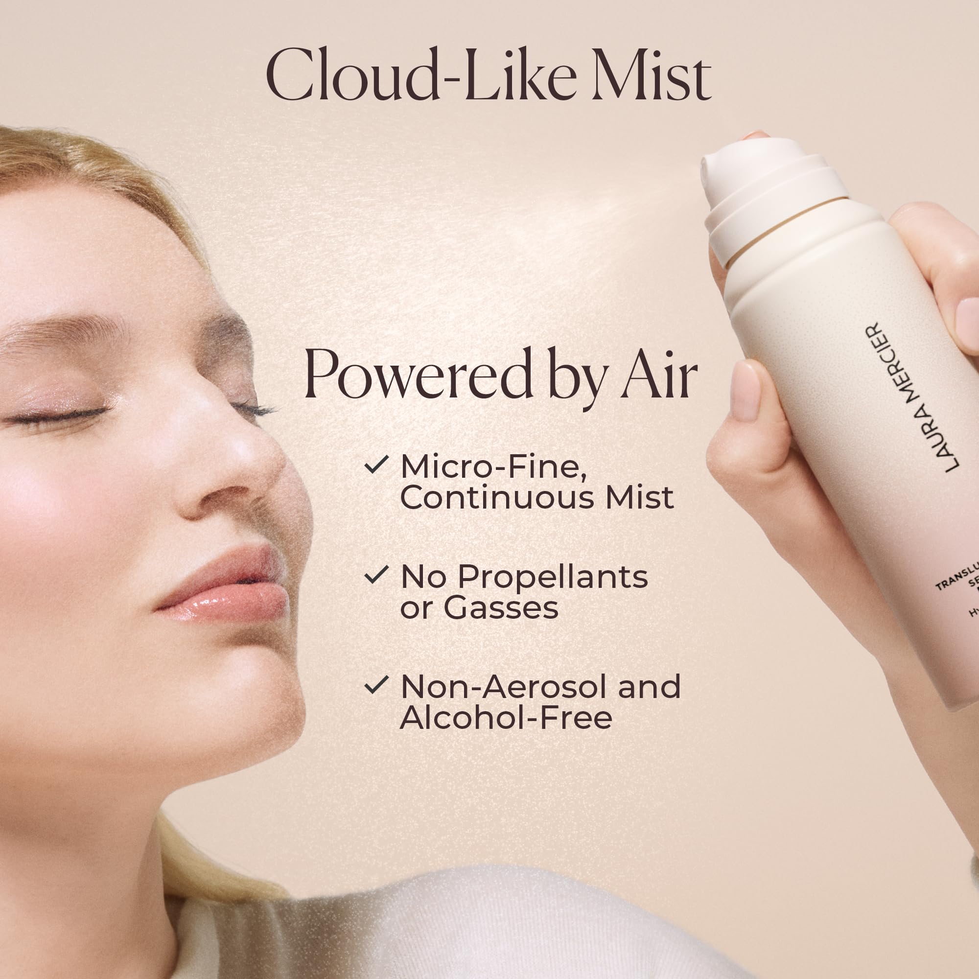 Close up of Laura Mercier setting spray nozzle and pink gradient bottle design