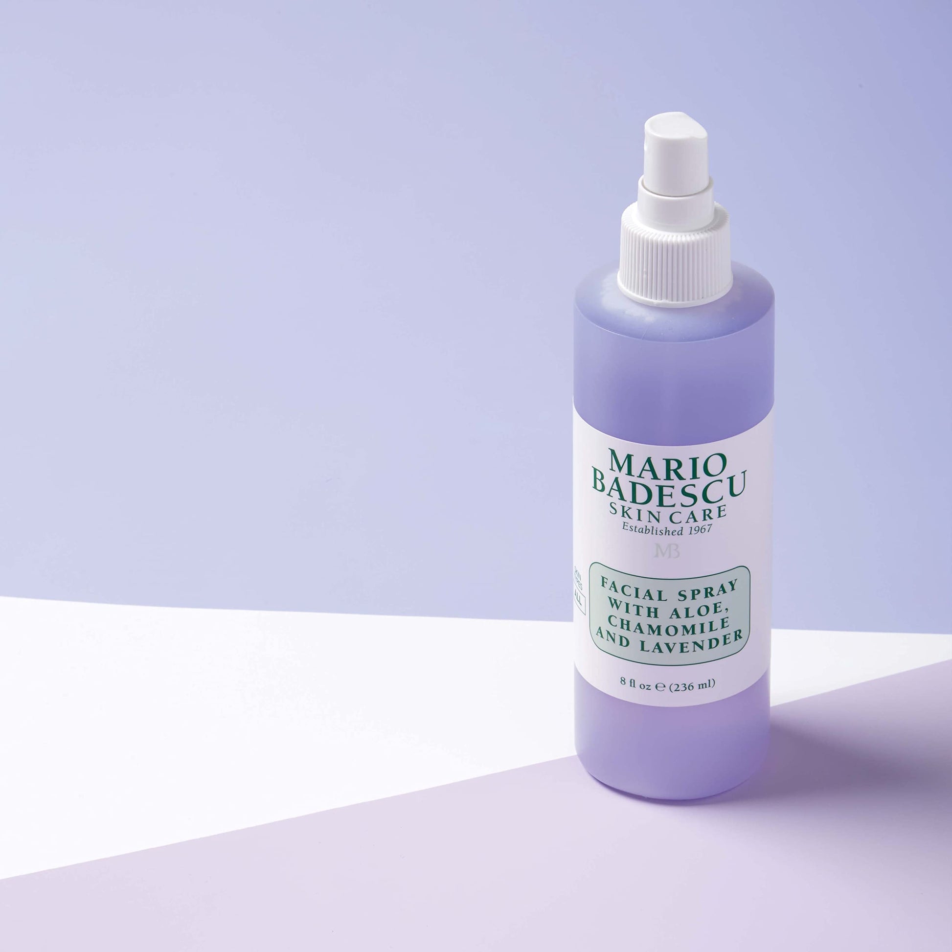 Side profile of the 8 fluid ounce Mario Badescu lavender face mist highlighting its clear liquid container.