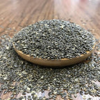 Stinging nettle seed powder being mixed into a healthy morning wellness smoothie.