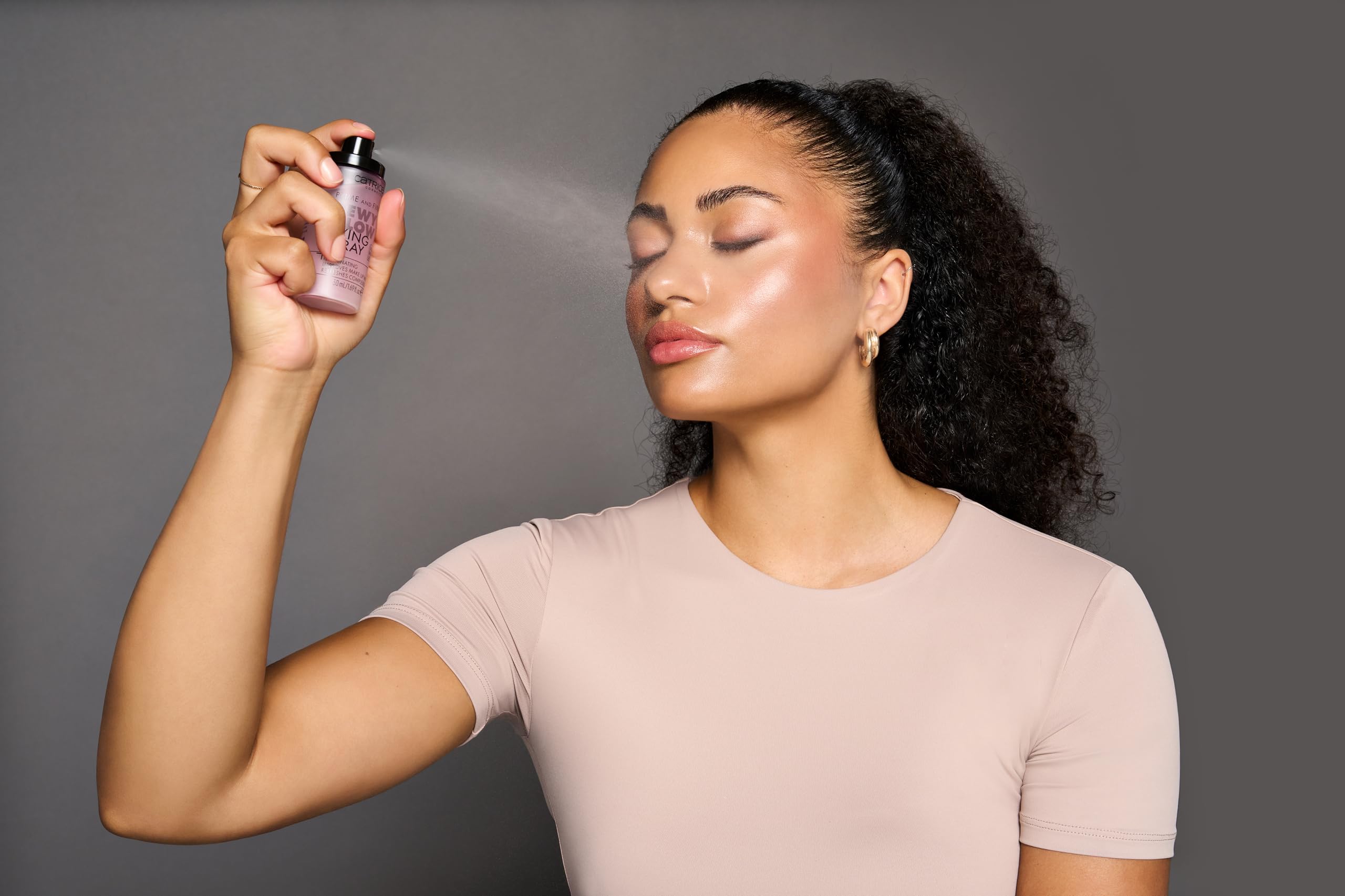Catrice dewy finish makeup setting spray 50ml travel friendly bottle on plain background