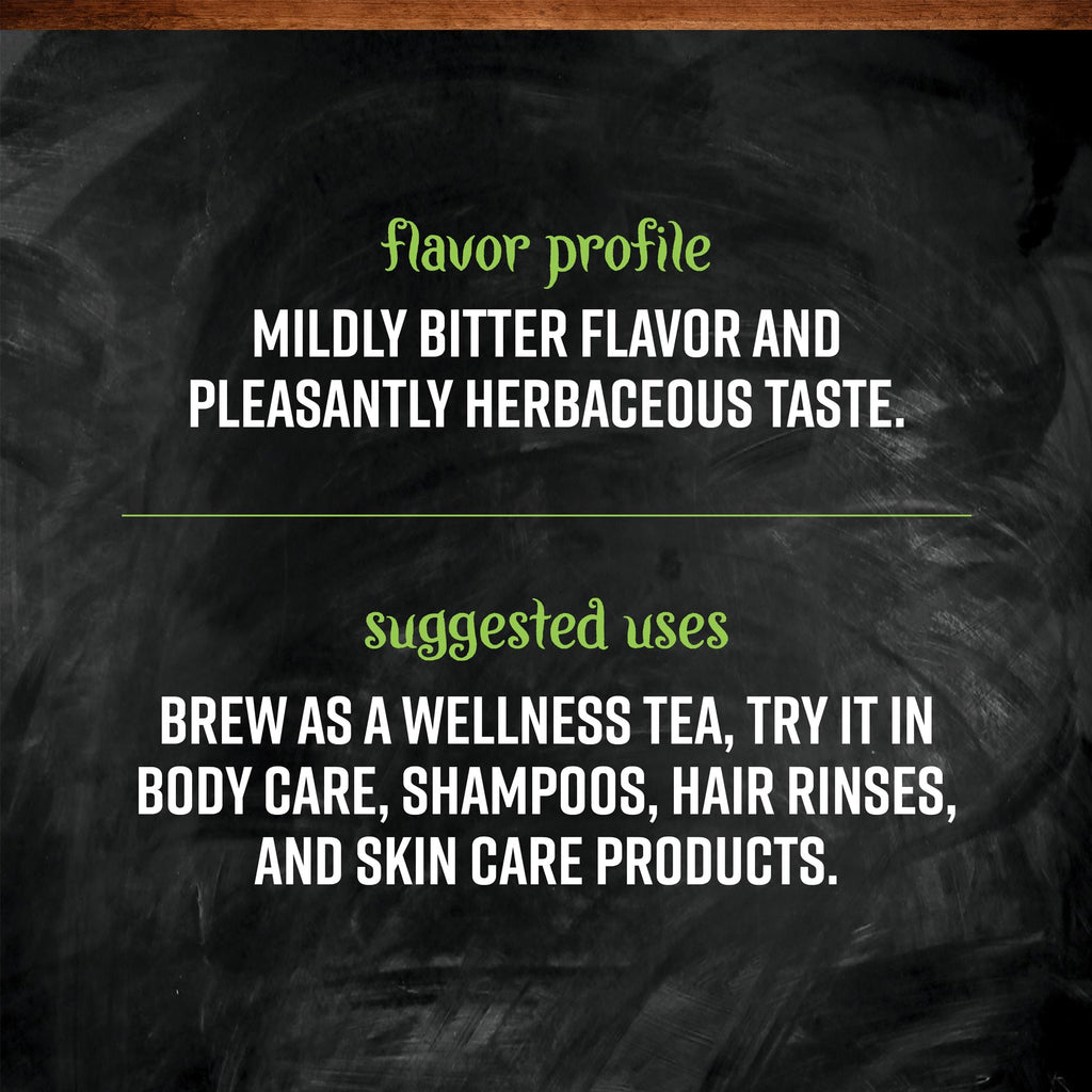 Brewed cup of organic nettle leaf tea with loose herbs