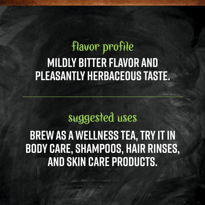 Brewed cup of organic nettle leaf tea with loose herbs
