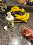 Cold pressed 100 percent pure noni fruit juice bottles highlighting the nutritional facts packaging