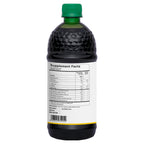Pure Nutrition Natural Treasures herbal juice bottle label detail featuring Garcinia and Aloe Vera ingredients.