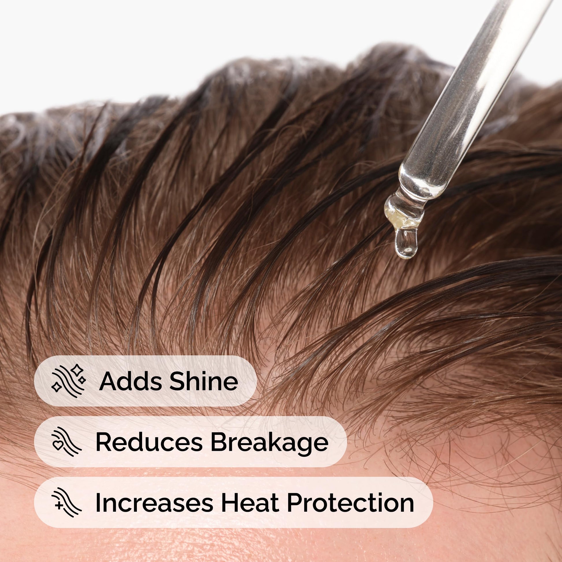 Applying The Ordinary squalane oil to hair for heat protection and shine.