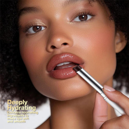 Natural lightweight lip gloss swatch on hand illustrating the buildable pink color payoff.