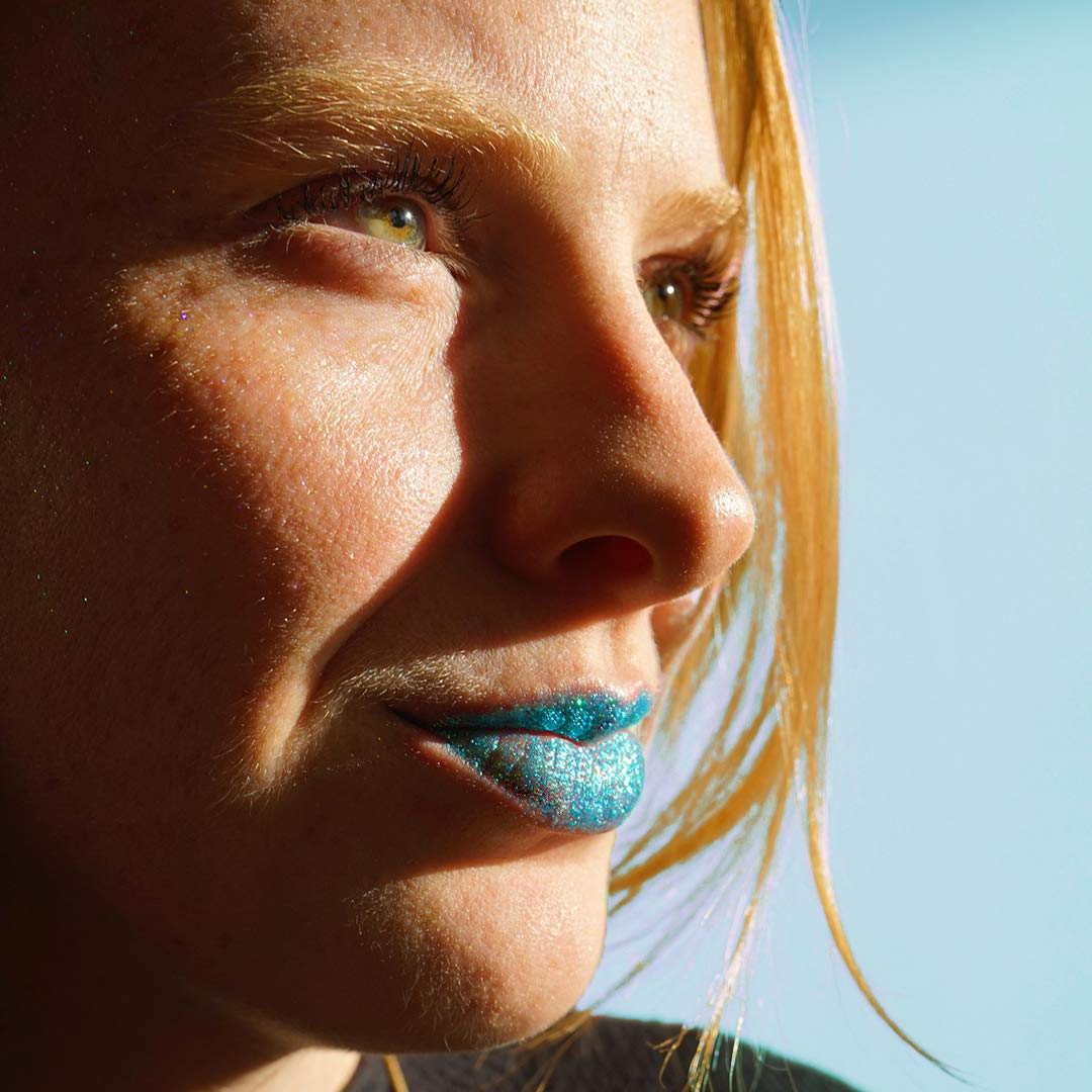 Close up of lips with glitter applied using Unicorn Snot primer