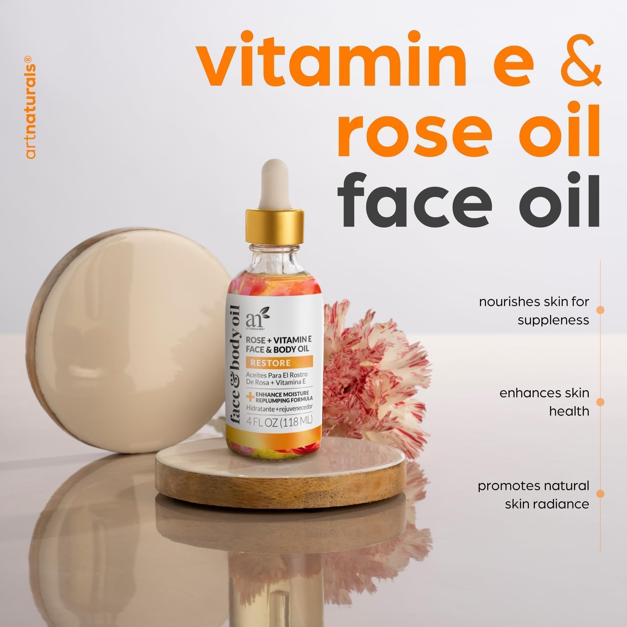Artnaturals four ounce face and body oil bottle with real rose buds