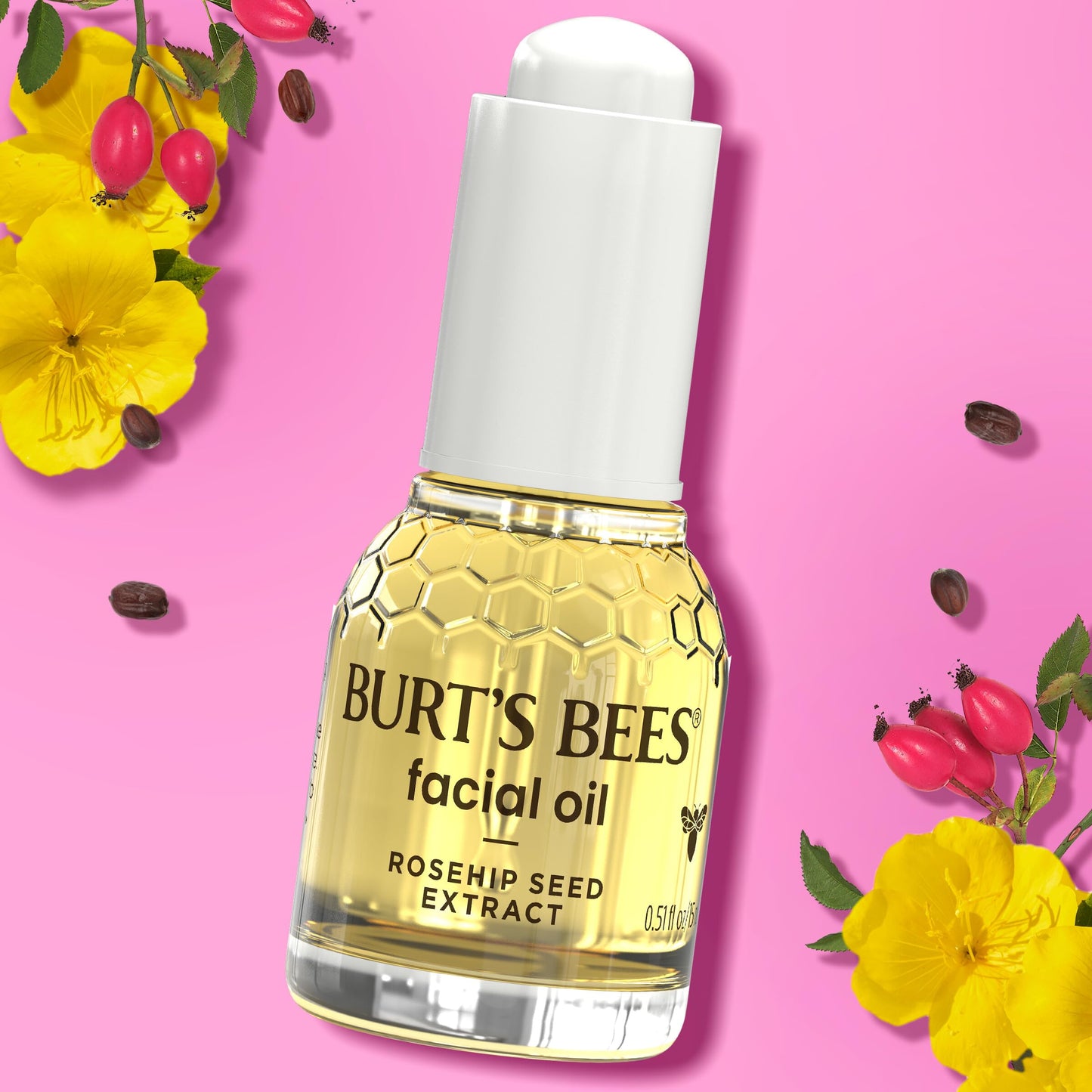 Burt's Bees facial oil being paired with a gua sha tool