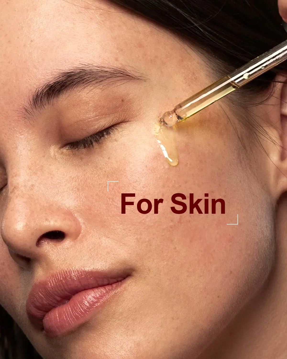 Pure organic rosehip seed oil being applied to the skin with a glass dropper