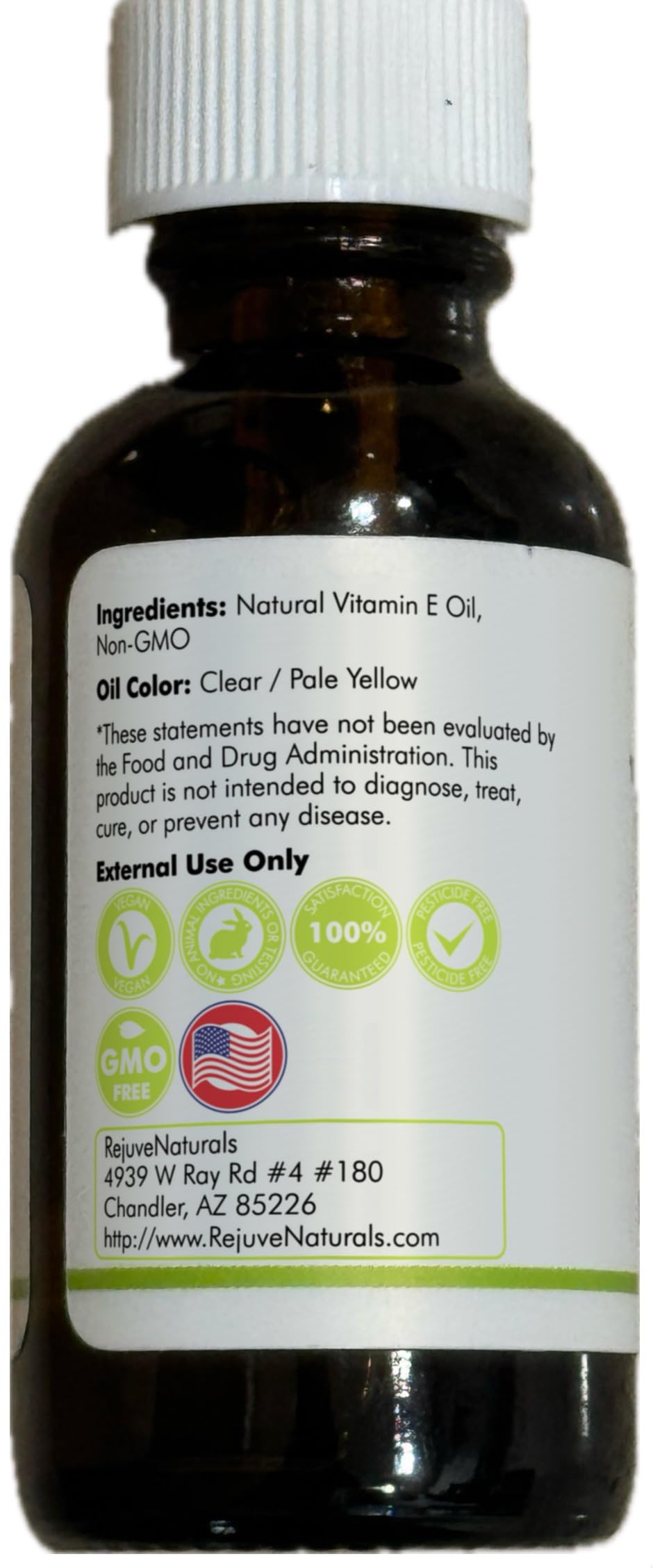 RejuveNaturals 100 percent pure vitamin E oil side view label confirming non GMO and vegan standard
