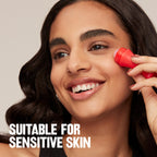 Portable compact facial roller shown next to travel bag