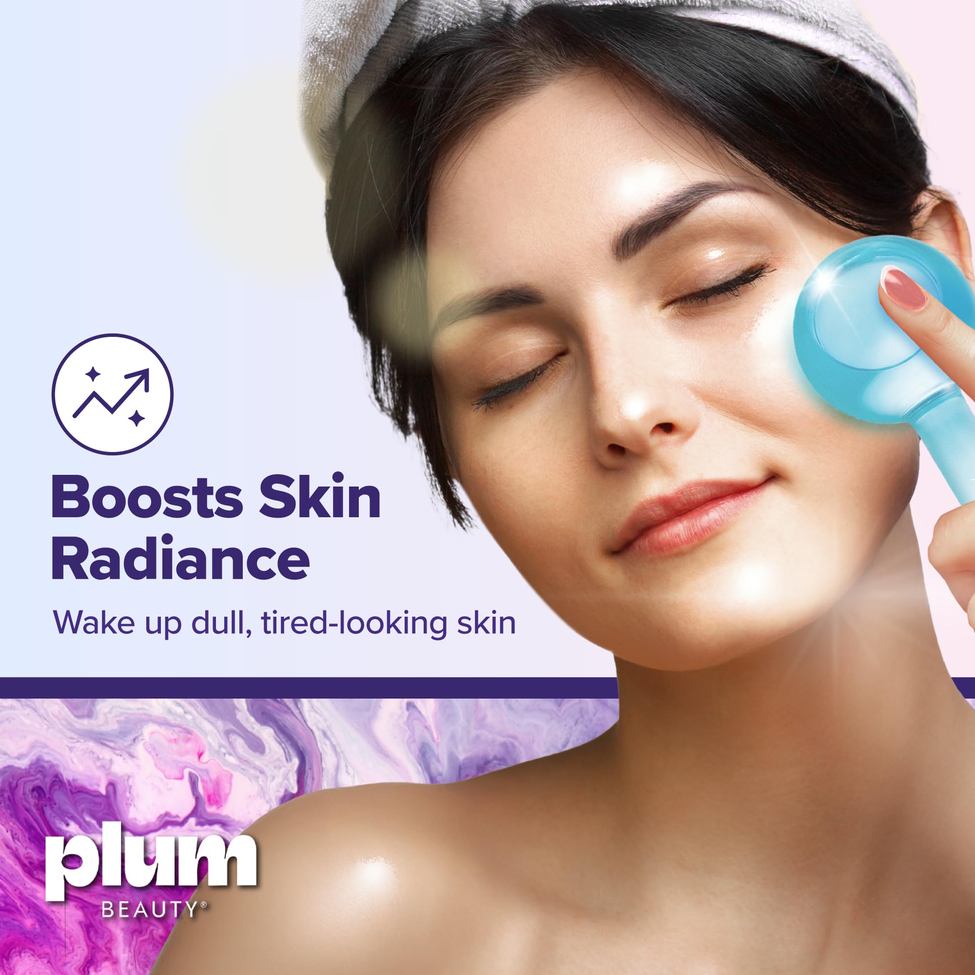 Plum Beauty facial massager globes placed next to a skincare serum bottle
