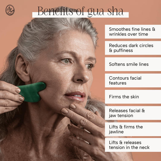 Authentic green jade face sculpting tool displayed on clean white backdrop