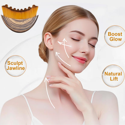 Lymphatic drainage face brush with soft golden bristles and an ergonomic wooden handle.