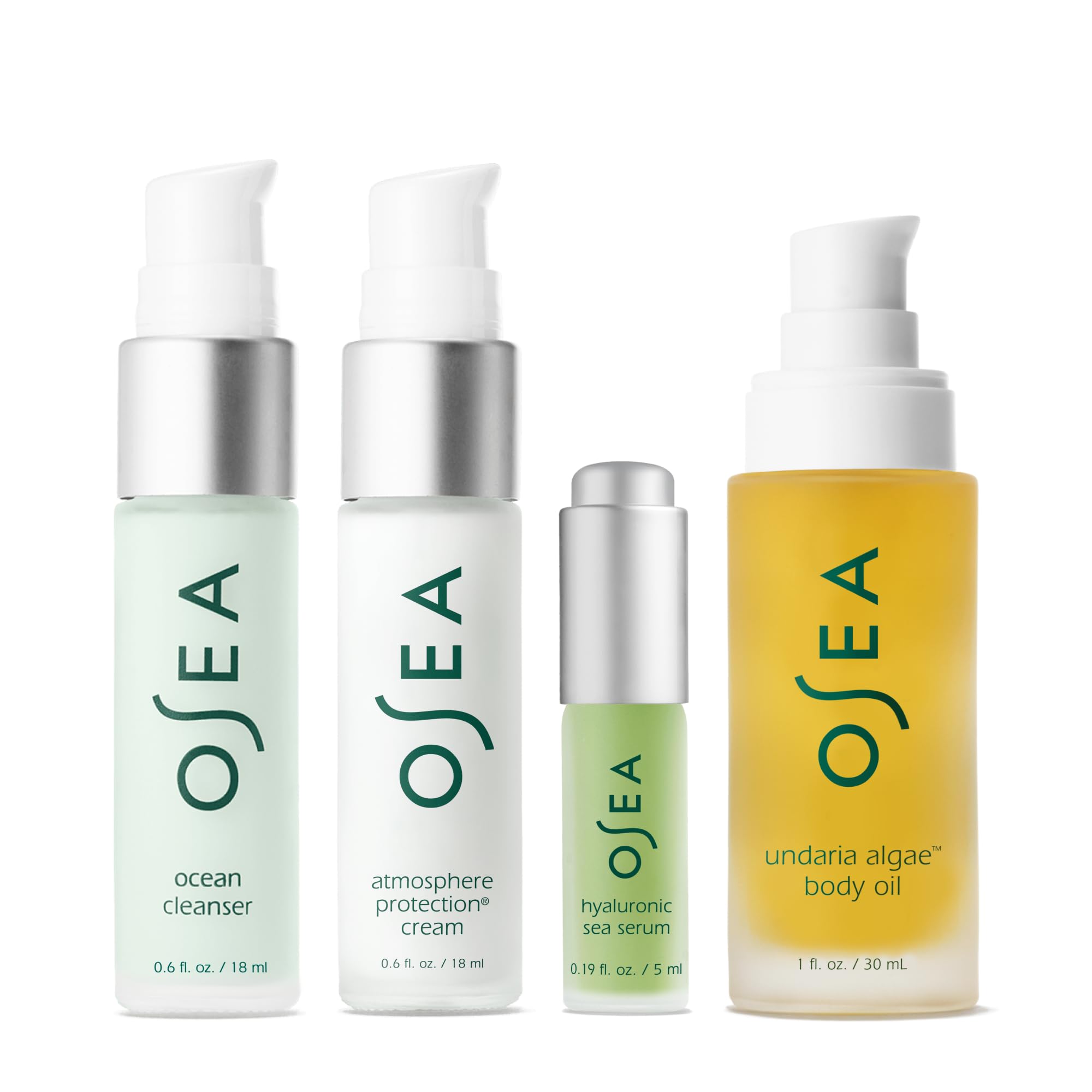 OSEA skincare travel kit items including cleanser serum face cream and algae body oil arranged neatly