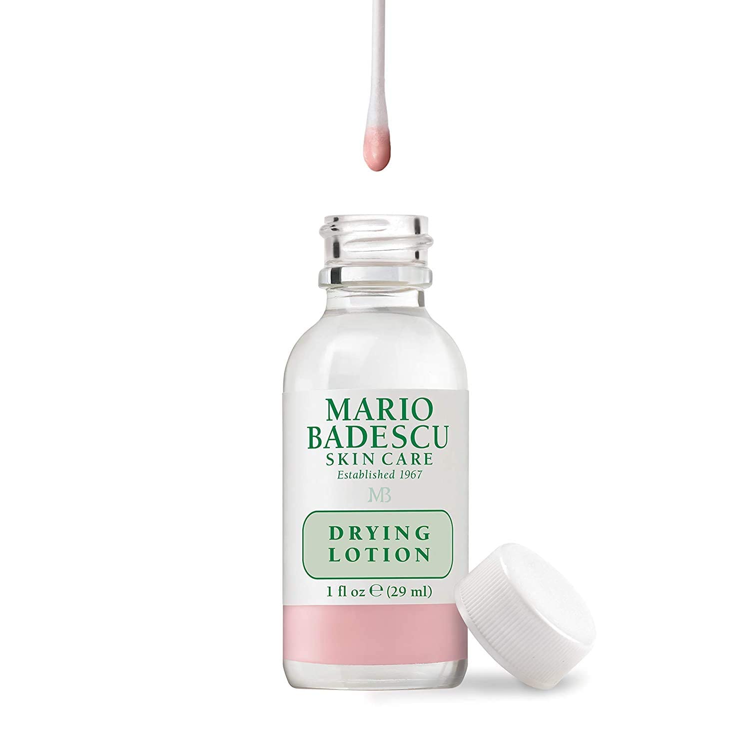 Close up of the Mario Badescu pink sediment bi-phase lotion bottle for targeted overnight acne care.