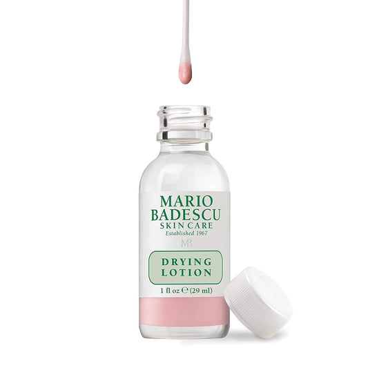 Close up of the Mario Badescu pink sediment bi-phase lotion bottle for targeted overnight acne care.