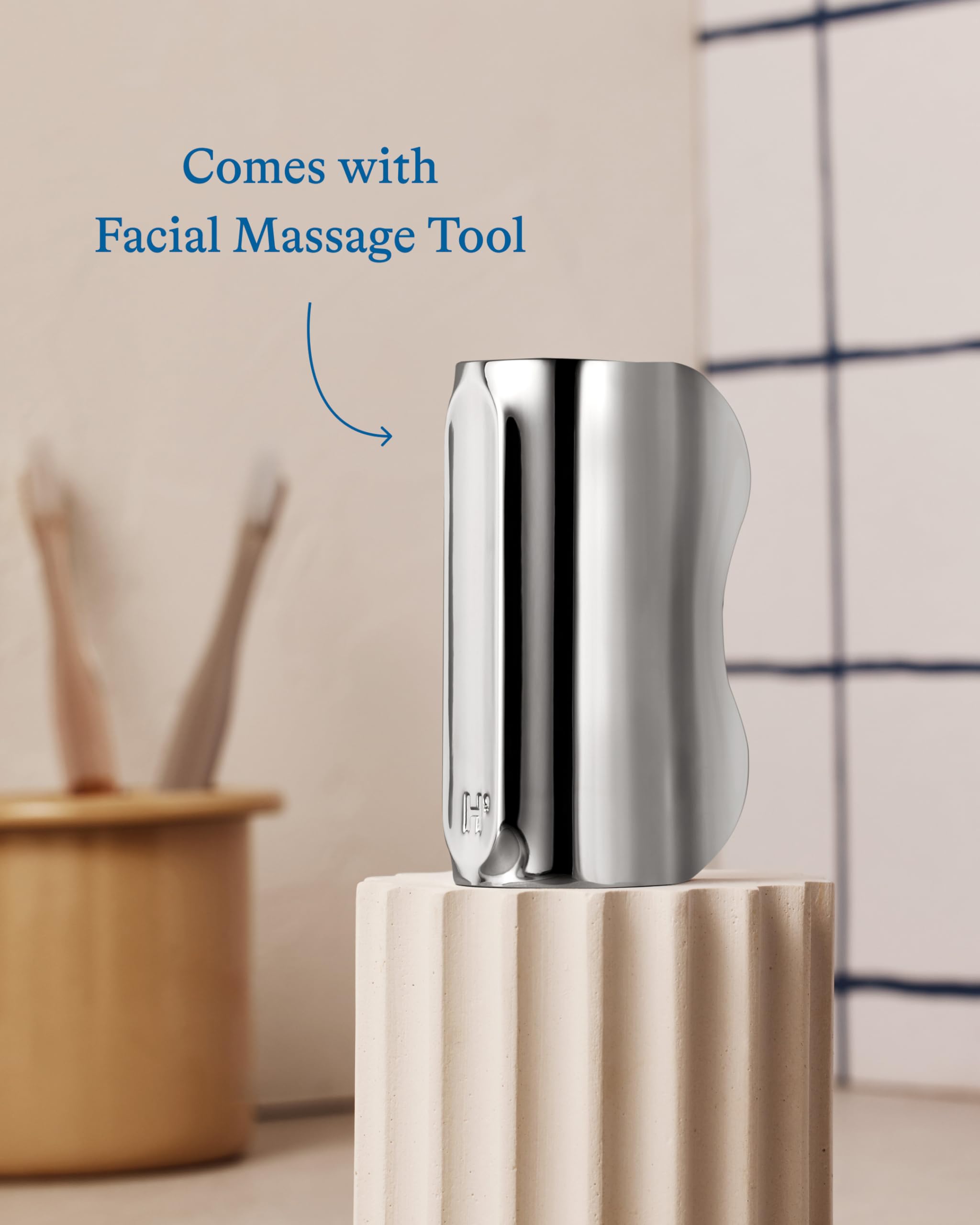 Demonstration of the cooling eye stick nesting inside the zinc facial massage tool for storage.