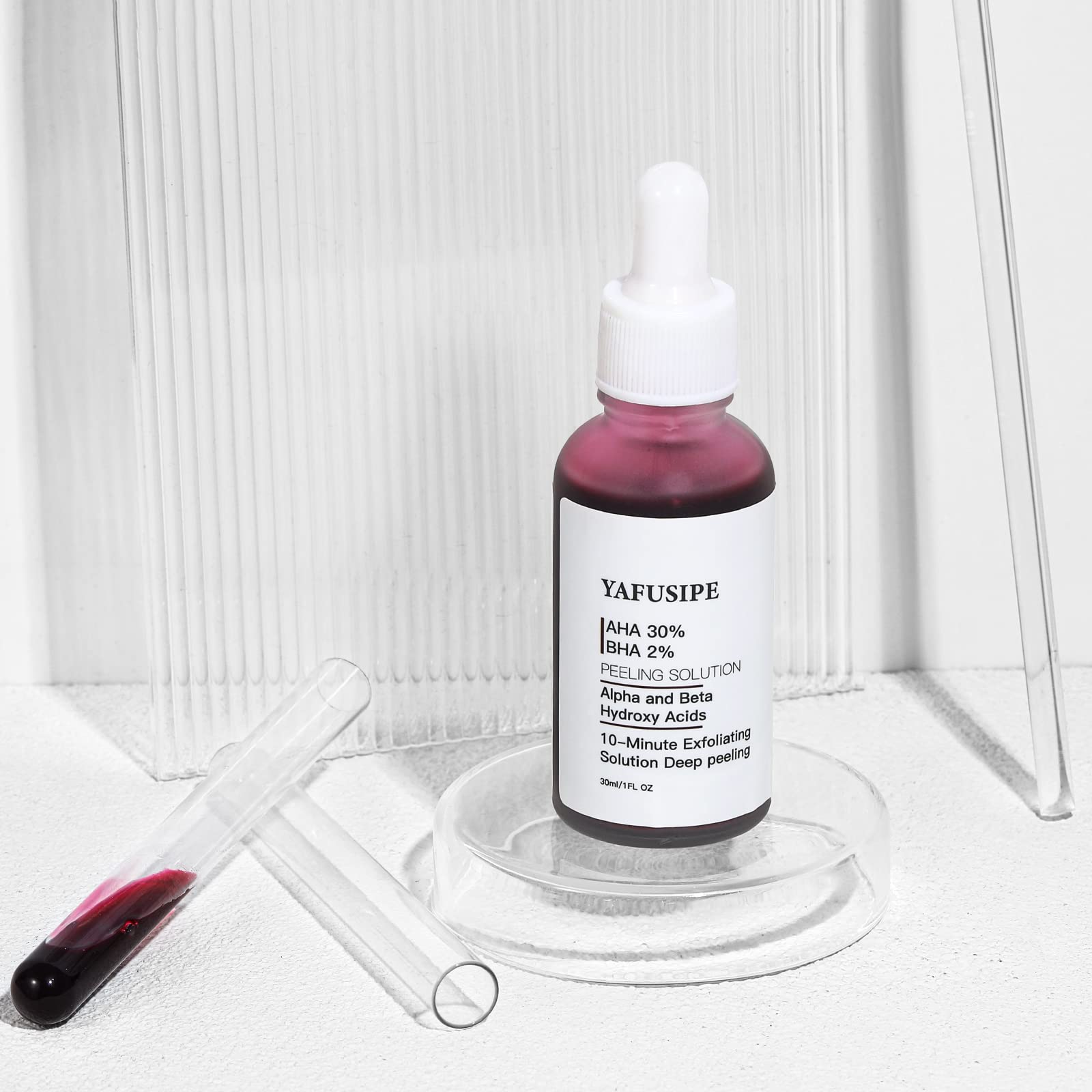Red liquid texture of The Ordinary exfoliating skin peel showing dropper application.