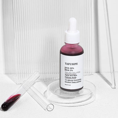 Red liquid texture of The Ordinary exfoliating skin peel showing dropper application.
