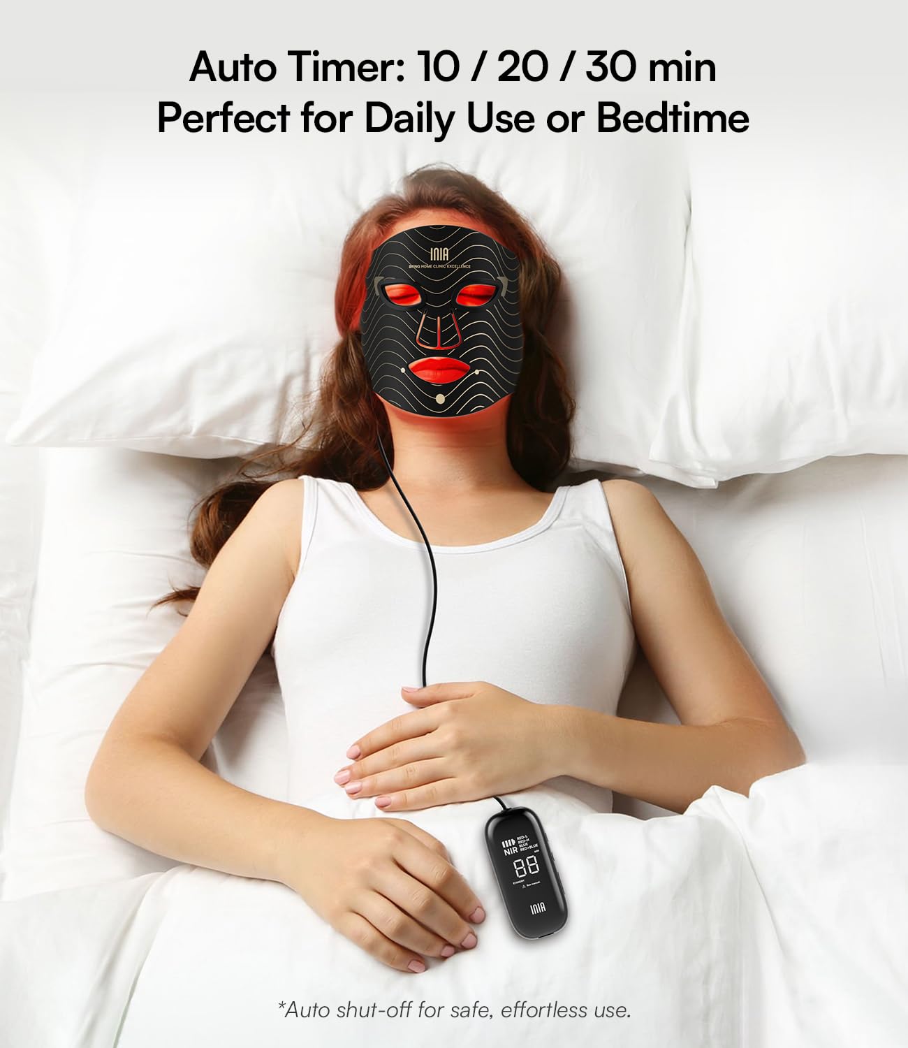 Model using Inia red light therapy mask for skincare