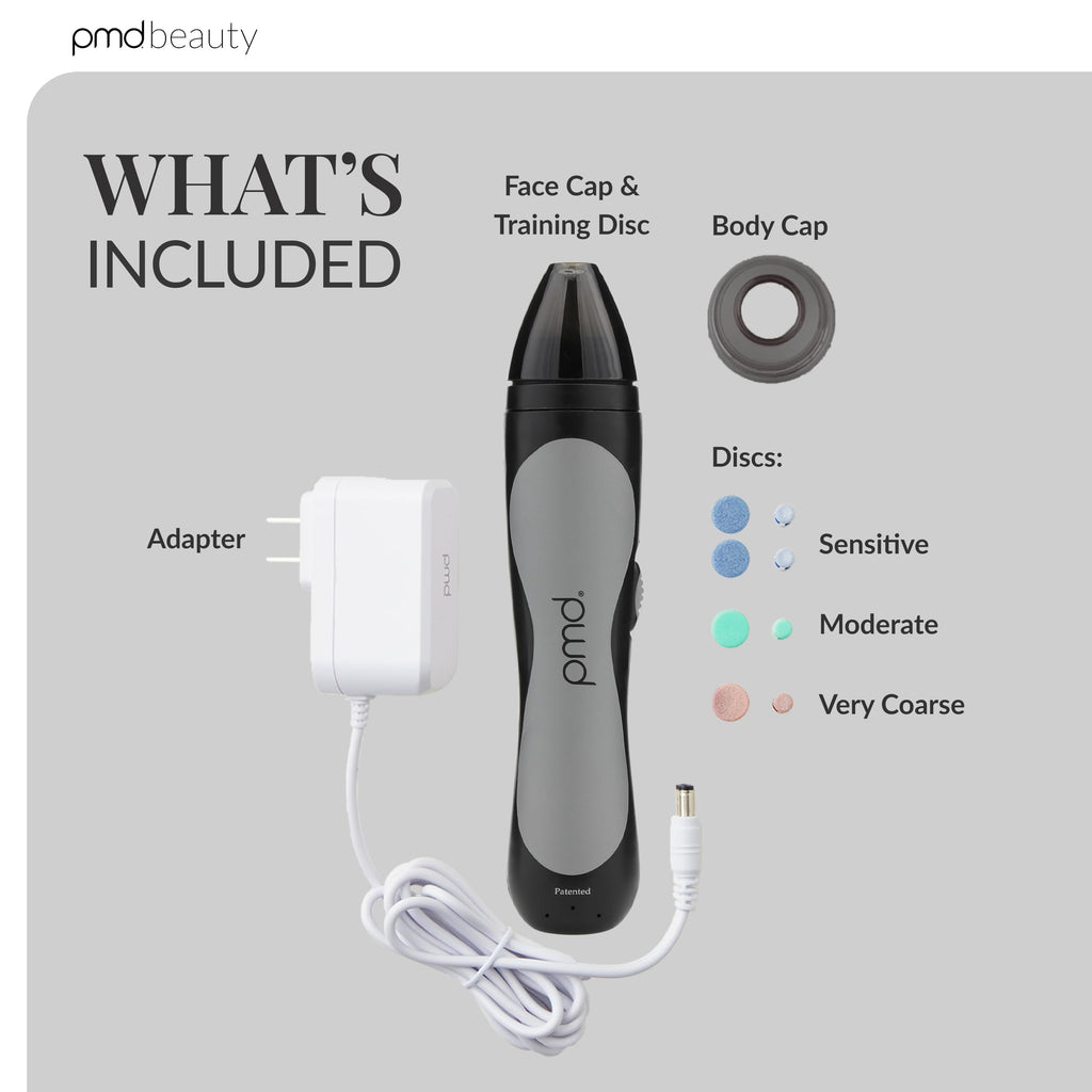 PMD Beauty microdermabrasion device in hand for scale