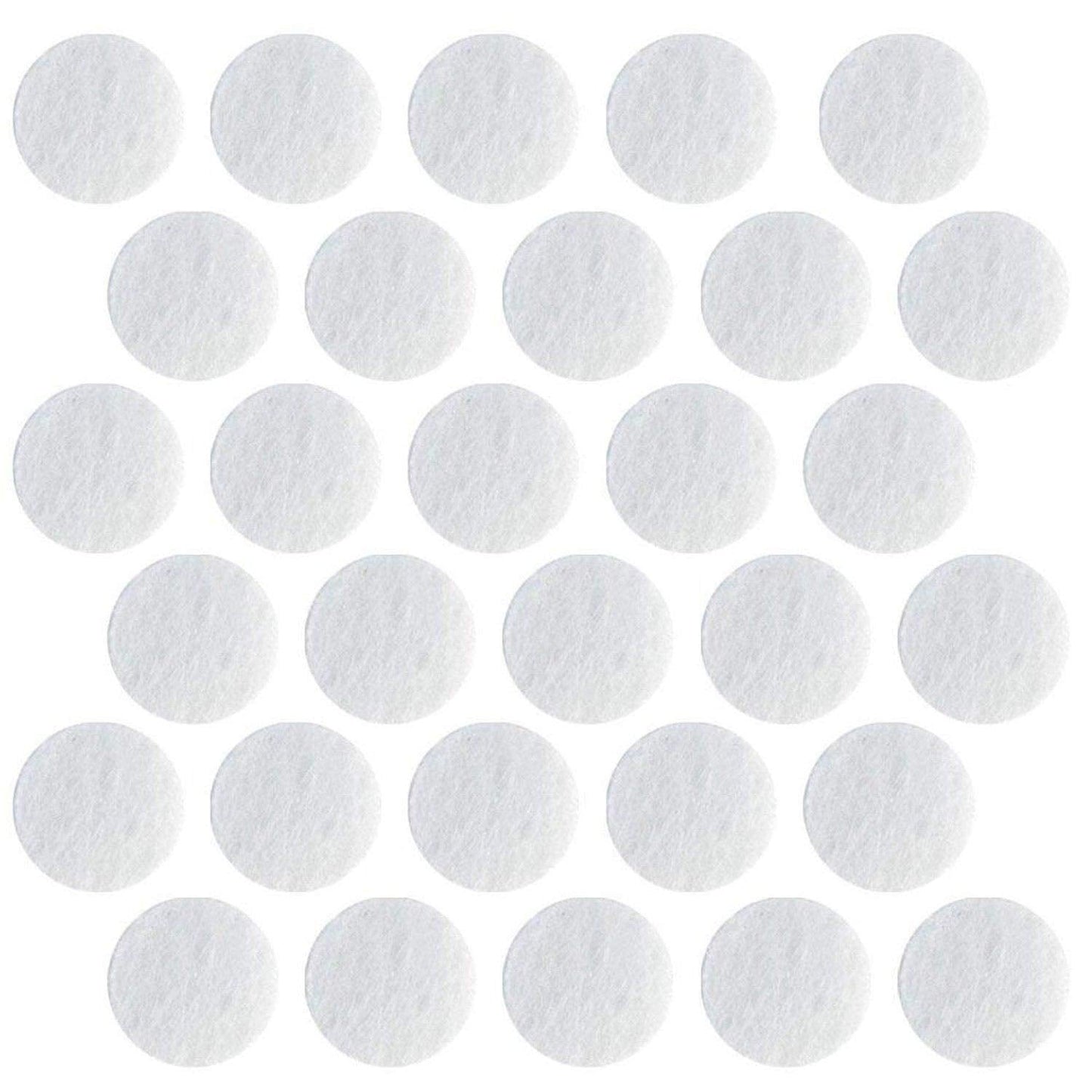 Close up view of the 150 grit D14.5 microdermabrasion replacement tips alongside 11mm cotton machine filters.