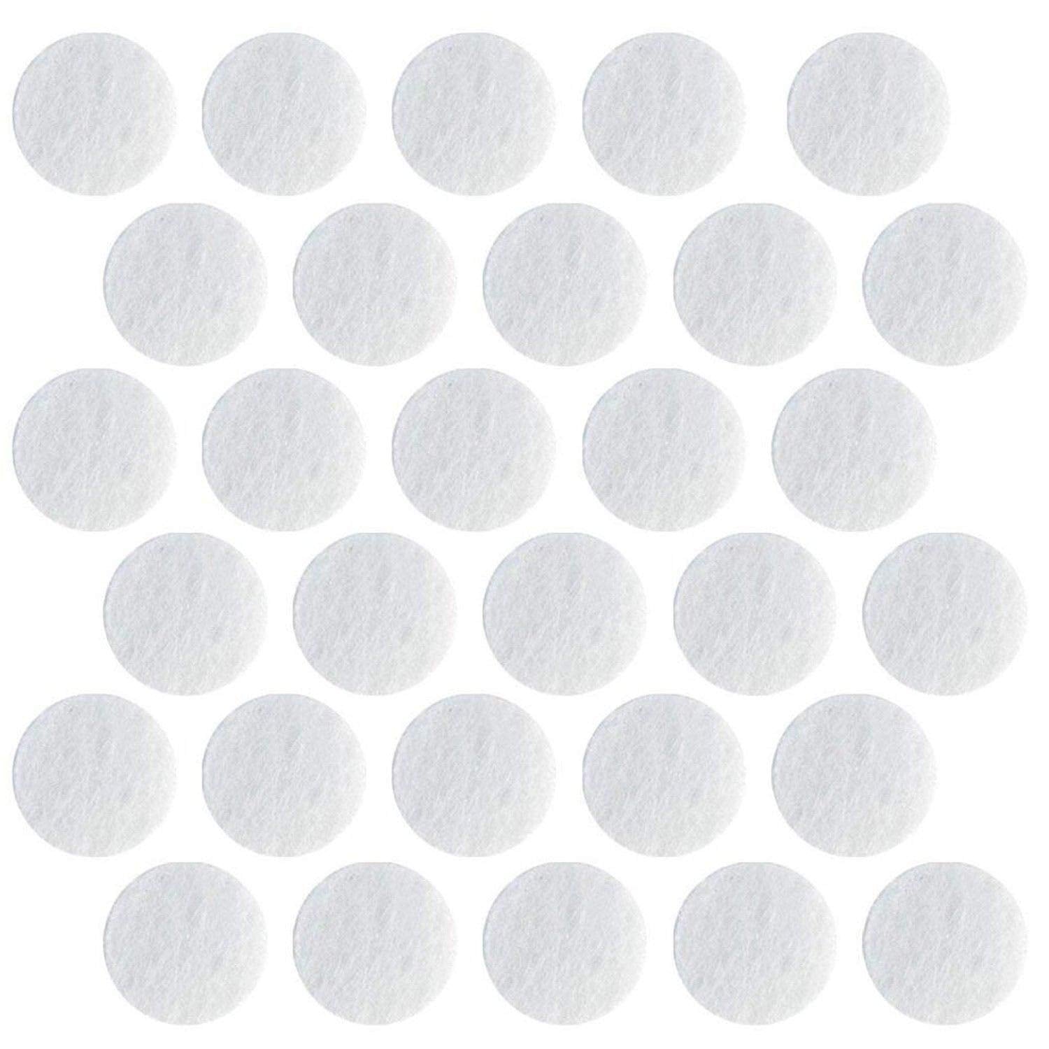 Close up view of the 150 grit D14.5 microdermabrasion replacement tips alongside 11mm cotton machine filters.