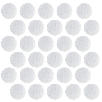Close up view of the 150 grit D14.5 microdermabrasion replacement tips alongside 11mm cotton machine filters.